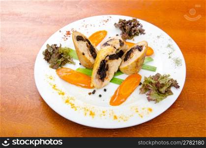 Meat and vegetable roll in plate