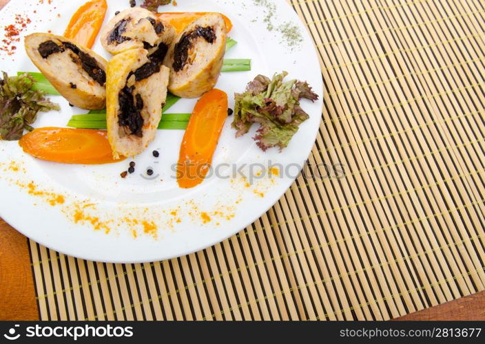 Meat and vegetable roll in plate