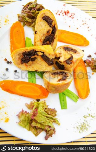 Meat and vegetable roll in plate