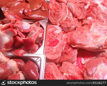 Meat background. Meat background - chicken legs, liver, beef and pork steaks at farm market