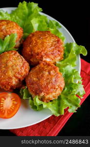 Meat balls in tomato sauce on a black background. Homemade protein meal for healthy eating.. Meat balls in tomato sauce on a black background. Homemade protein meal for healthy diet.