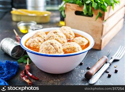 Meat balls in tomato sauce with spices.
