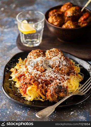 Meat balls with pasta in tomato sauce.