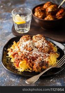 Meat balls with pasta in tomato sauce.