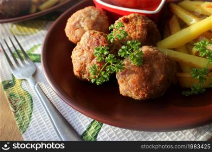 Meat balls with potato fries and tomato sauce. Meat balls with potato fries