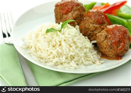 meat balls with rice and vegetables close up
