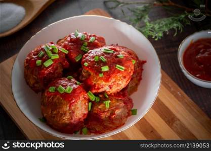 Meat balls with tomato sauce and herbs. Source of protein - delicious meat balls stewed in tomato sauce with onions. Meat balls with tomato sauce and herbs