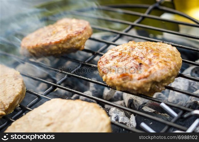 Meat cooking on a barbecue BBQ grill