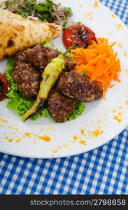 Meat cuisine - kebab served in plate