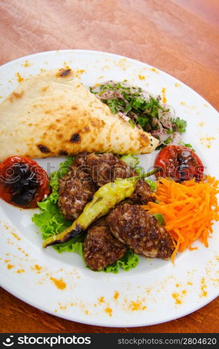 Meat cuisine - kebab served in plate