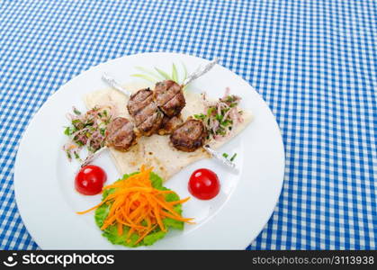 Meat cuisine - kebab served in plate