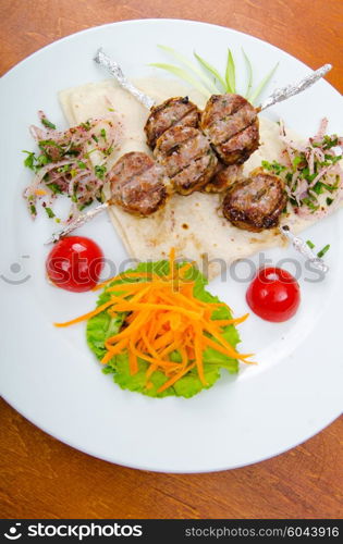 Meat cuisine - kebab served in plate