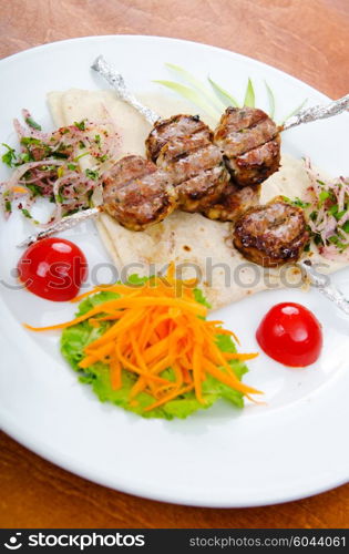 Meat cuisine - kebab served in plate