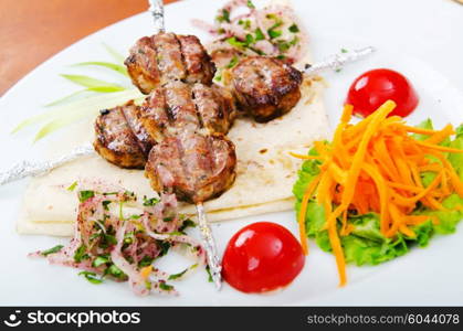 Meat cuisine - kebab served in plate