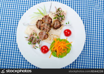 Meat cuisine - kebab served in plate