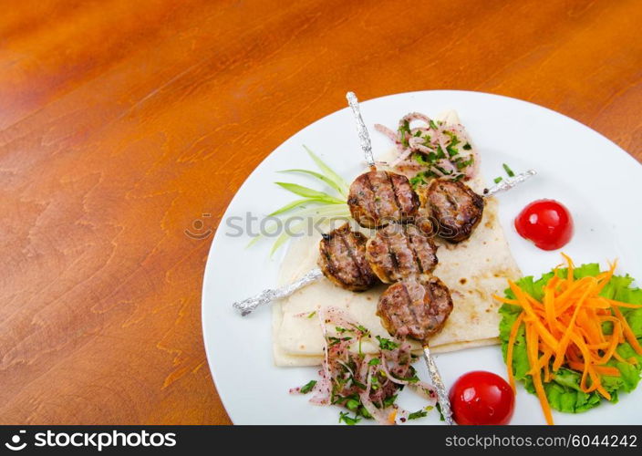 Meat cuisine - kebab served in plate