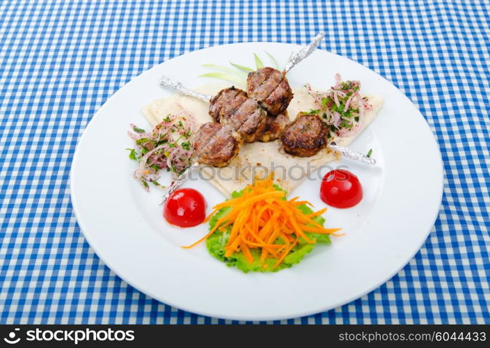 Meat cuisine - kebab served in plate