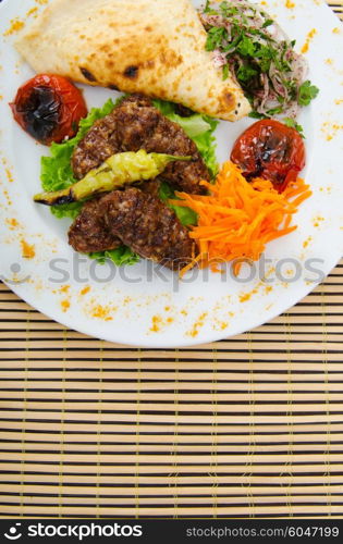 Meat cuisine - kebab served in plate