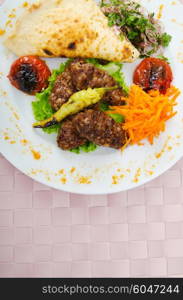 Meat cuisine - kebab served in plate