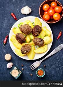 Meat cutlets and potatoes. Meat cutlets and fried potatoes for garnish