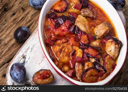 meat in plum sauce. dish of pork stewed in plum sauce