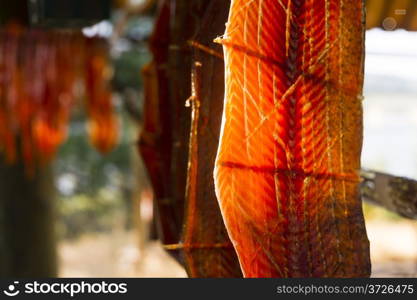 Meat is cut and hanged to dry outdoors in the lodge