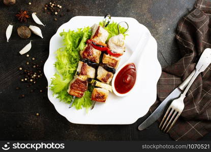 meat kebab with salad leaf and ketchup