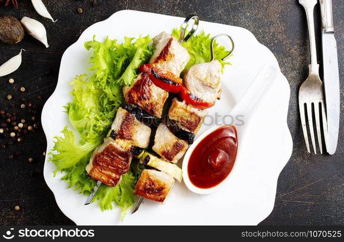 meat kebab with salad leaf and ketchup