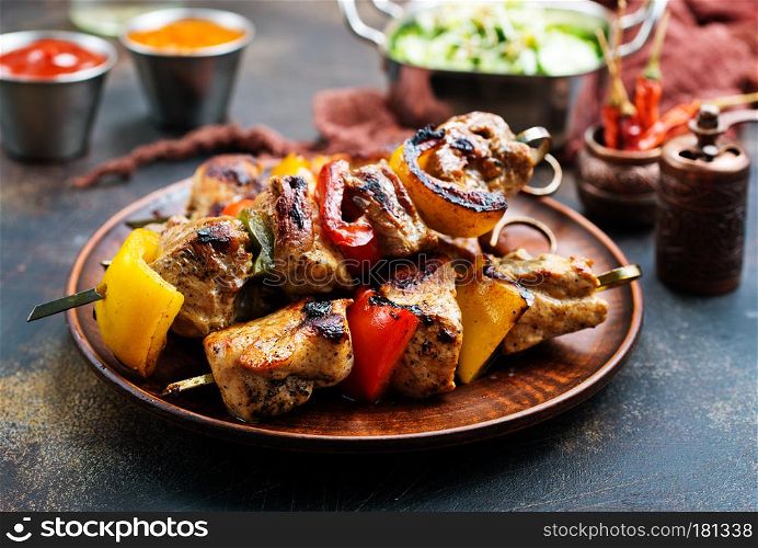 meat kebab with vegetables on plate, fresh kebab with sauce