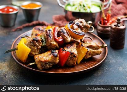 meat kebab with vegetables on plate, fresh kebab with sauce
