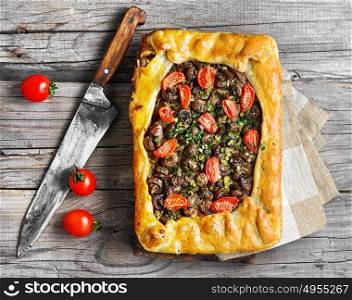meat pie with mushroom. baking meat pie stuffed with mushrooms and tomato