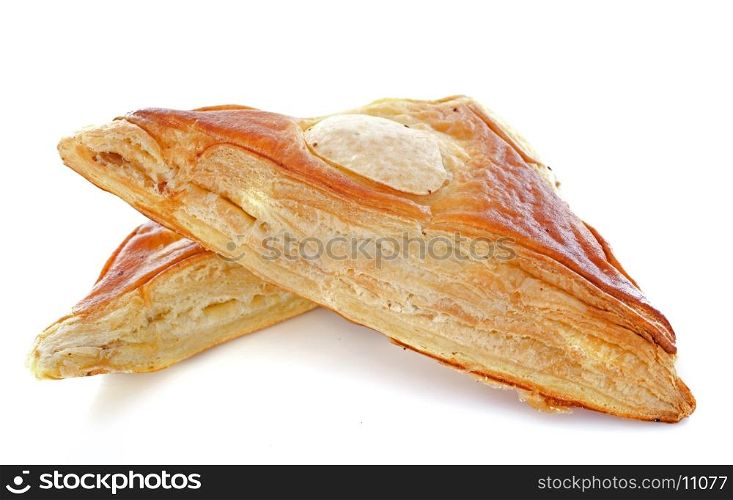 meat pies in front of white background