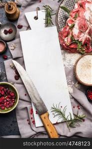 Meat roast preparation with blank white marble cutting board, kitchen knife , rice and cooking ingredients, top view, frame. Meat food background