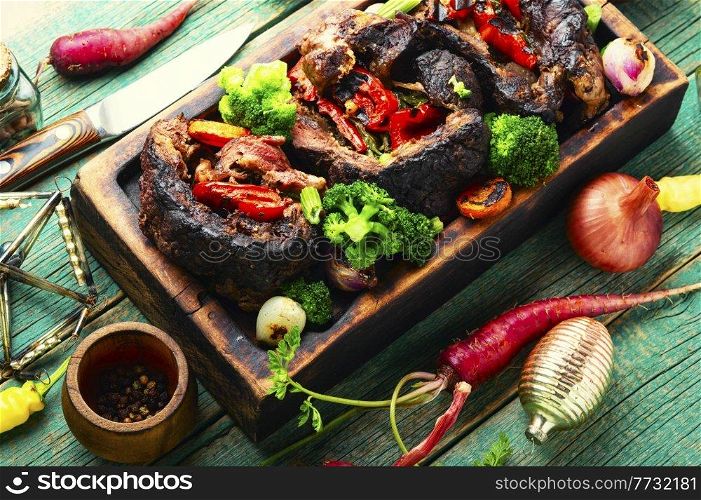 Meat roasted with bell pepper and broccoli.Festive christmas food. Beef roll for the Christmas table
