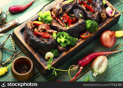 Meat roasted with bell pepper and broccoli.Festive christmas food. Beef roll for the Christmas table