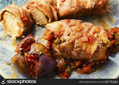 Meat rolls roasted with autumn figs. Close up,macro,. Meat fried rolls,macro