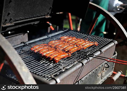 meat sausages cooking on grill