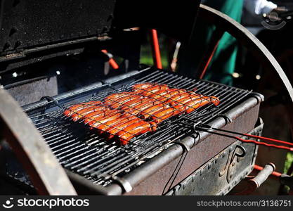 meat sausages cooking on grill