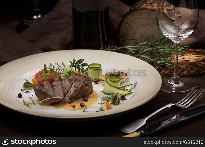 Meat steak with vegetables. Meat steak with vegetables in plate