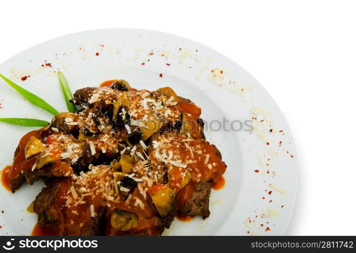 Meat under tasty sauce in plate