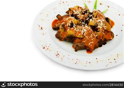 Meat under tasty sauce in plate