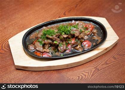 meat with vegetables at frying pan. meat with vegetables