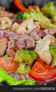 meat with vegetables. meat with vegetables at frying pan