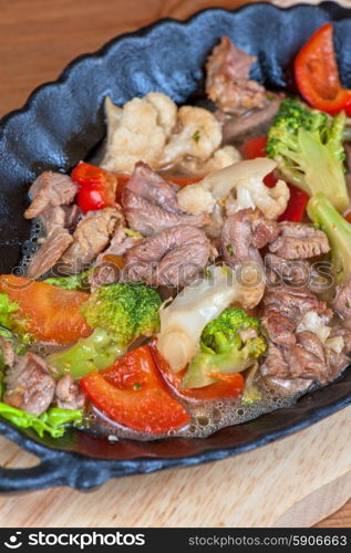 meat with vegetables. meat with vegetables at frying pan