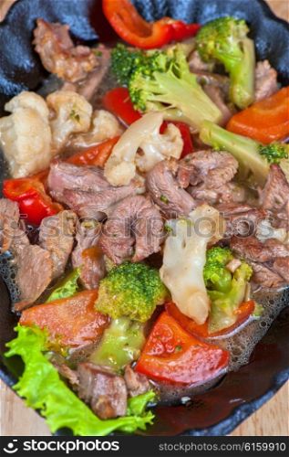 meat with vegetables. meat with vegetables at frying pan