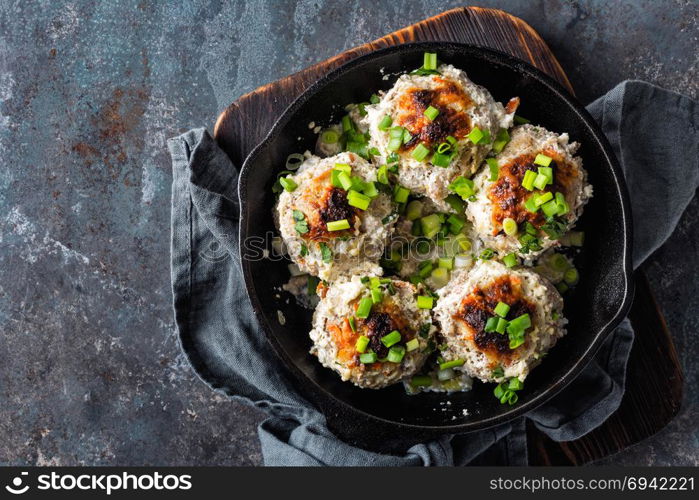 meatballs baked in sour cream sauce in pan