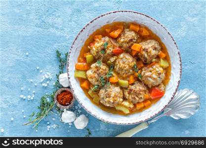 Meatballs in sauce with vegetables, top view