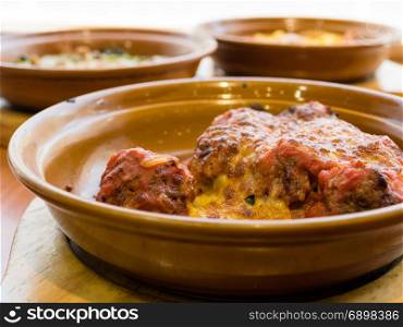 Meatballs in tomato and cheese sauce