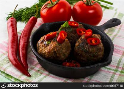 Meatballs served in a cast iron skillet. Meatballs served in a cast iron skillet. Turkish meatball. Meatloaf. Grilled meatballs. Meatballs.