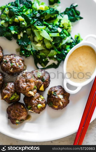 Meatballs with green salad and honey mustard sauce